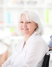 Happy older woman in a wheel chair.