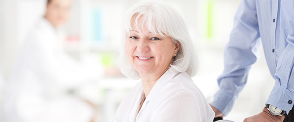 Happy older woman in a wheel chair.