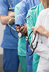 A group of doctors holding stethoscopes.